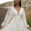 Elegant Flowy Bohemian Chiffon Wedding Dress with Puff Sleeves and V-Neck