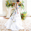 Elegant Floral Lace A-Line Wedding Dress with Illusion Back and Sweep Train