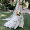 Elegant Floral Lace A-Line Wedding Dress with Illusion Back and Sweep Train