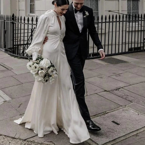 Elegant Halter Neck A-Line Wedding Dress with Puff Sleeves and Backless Design