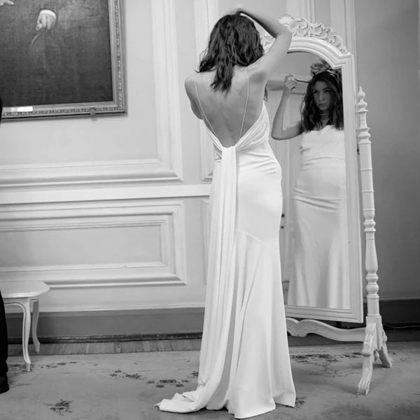 Sophisticated Minimalist Mermaid Wedding Dress with Criss-Cross Detail and Sweep Train