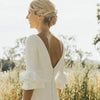 Chic Minimalist Satin Wedding Dress with V-Neck and Sweep Train - Elegant Backless Design