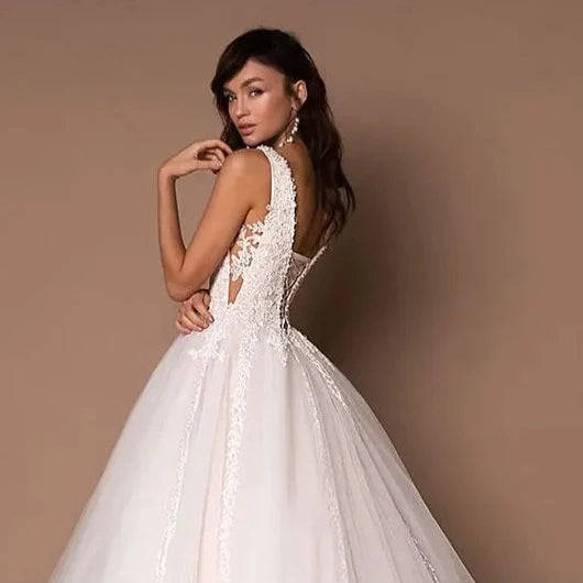 Boho Chic Sleeveless A-Line Tulle Wedding Dress with Floral Embroidery and V-Neck