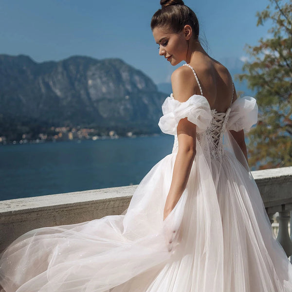 Elegant Lace & Beaded Tulle A-Line Wedding Dress with Spaghetti Straps & Chapel Train