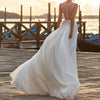 Vintage Bohemian Chiffon Wedding Dress with Lace Detailing and a V-Neck