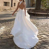 Elegant Halter Neck Satin Wedding Dress with Backless Design and Sweep Train