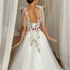 Elegant White Tulle Prom Dress with Sweet Floral Details and Spaghetti Straps