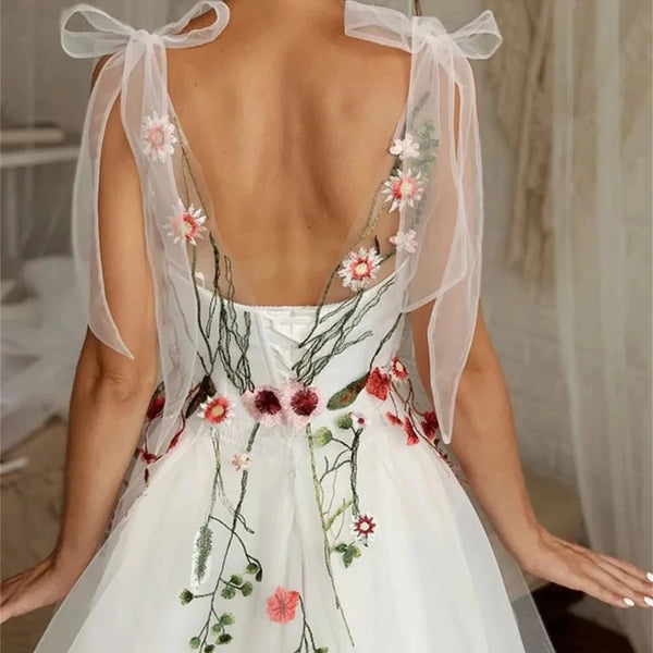 Elegant White Tulle Prom Dress with Sweet Floral Details and Spaghetti Straps