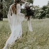 Boho Lace Wedding Dress with Long Flare Sleeves and Sweep Train