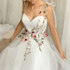 Elegant White Tulle Prom Dress with Sweet Floral Details and Spaghetti Straps