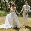 Romantic Cap Sleeves Embroidered Floral Wedding Dress with Plunge V-Neck and Sweep Train